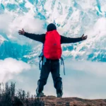 Trekker Red Backpack Snowy Mountains View